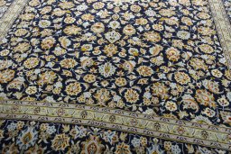 Close-up detail of 2000s Kashan rug from Iran / Persia showing Wool weave