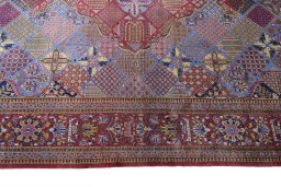 Corner detail of 1930s Kashan rug showing border pattern and Silk pile