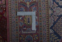 Backside of handmade 1930s Kashan rug showing knot structure and weave density