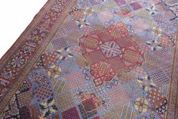 Backside of handmade 1930s Kashan rug showing knot structure and weave density