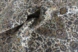 Surface texture of 2000s Kashan rug with natural Cork and intricate pattern