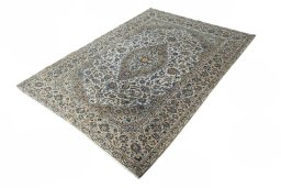Corner detail of 2000s Kashan rug showing border pattern and Cork pile