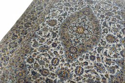Backside of handmade 2000s Kashan rug showing knot structure and weave density
