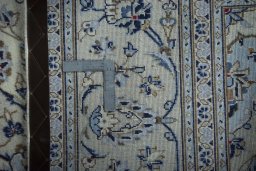 Close-up detail of 2000s Kashan rug from Iran / Persia showing Wool weave