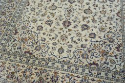 Close-up detail of 2000s Kashan rug from Iran / Persia showing Wool weave