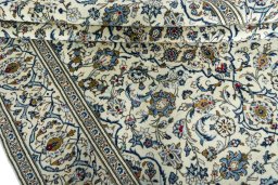 Close-up detail of 2000s Kashan rug from Iran / Persia showing Wool weave