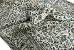 Surface texture of 2000s Kashan rug with natural Wool and intricate pattern
