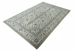 Corner detail of 2000s Kashan rug showing border pattern and Wool pile