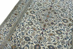 Backside of handmade 2000s Kashan rug showing knot structure and weave density