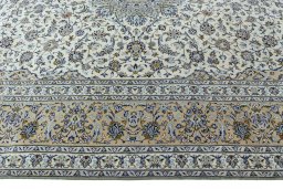 Corner detail of 2000s Kashan rug showing border pattern and Wool pile