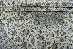 Close-up detail of 2000s Kashan rug from Iran / Persia showing Wool weave