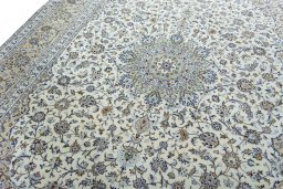 Backside of handmade 2000s Kashan rug showing knot structure and weave density