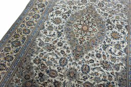 Backside of handmade 2000s Kashan rug showing knot structure and weave density