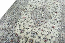 Backside of handmade New Kashan rug showing knot structure and weave density