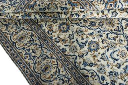 Close-up detail of 2000s Kashan rug from Iran / Persia showing Wool weave