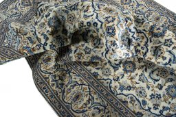 Surface texture of 2000s Kashan rug with natural Wool and intricate pattern