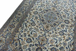 Backside of handmade 2000s Kashan rug showing knot structure and weave density