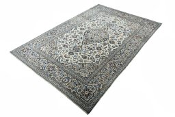 Corner detail of 2000s Kashan rug showing border pattern and Wool pile