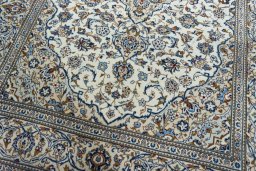 Close-up detail of 2000s Kashan rug from Iran / Persia showing Wool weave