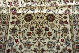 Corner detail of New Kashan rug showing border pattern and Wool pile