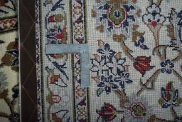 Close-up detail of New Kashan rug from Iran / Persia showing Wool weave