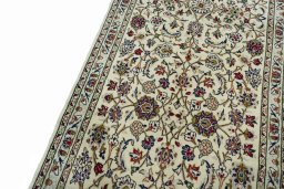 Backside of handmade New Kashan rug showing knot structure and weave density