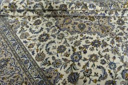 Close-up detail of 2000s Kashan rug from Iran / Persia showing Wool weave