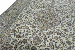 Backside of handmade 2000s Kashan rug showing knot structure and weave density