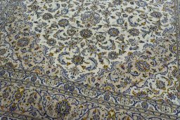 Close-up detail of 2000s Kashan rug from Iran / Persia showing Wool weave