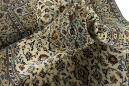 Surface texture of 2000s Kashan rug with natural Cork and intricate pattern