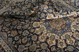 Surface texture of 2000s Kashan rug with natural Wool and intricate pattern