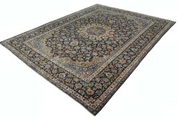 Corner detail of 2000s Kashan rug showing border pattern and Wool pile