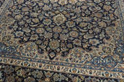 Close-up detail of 2000s Kashan rug from Iran / Persia showing Wool weave