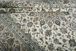 Close-up detail of 2000s Kashan rug from Iran / Persia showing Wool weave