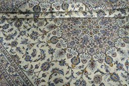 Close-up detail of 2000s Kashan rug from Iran / Persia showing Wool weave