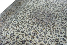 Backside of handmade 2000s Kashan rug showing knot structure and weave density