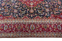 Corner detail of New Kashan rug showing border pattern and Cork pile