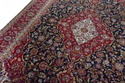 Backside of handmade New Kashan rug showing knot structure and weave density