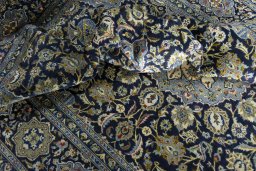 Surface texture of 2000s Kashan rug with natural Wool and intricate pattern