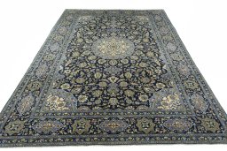 Surface texture of 2000s Kashan rug with natural Wool and intricate pattern