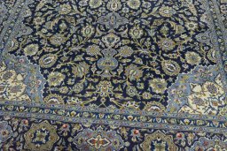 Close-up detail of 2000s Kashan rug from Iran / Persia showing Wool weave