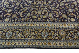 Corner detail of 2000s Kashan rug showing border pattern and Wool pile