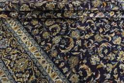 Close-up detail of 2000s Kashan rug from Iran / Persia showing Wool weave