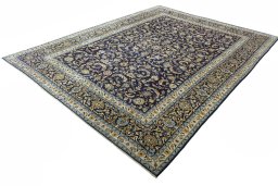 Corner detail of 2000s Kashan rug showing border pattern and Wool pile