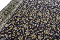 Backside of handmade 2000s Kashan rug showing knot structure and weave density