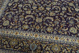 Close-up detail of 2000s Kashan rug from Iran / Persia showing Wool weave