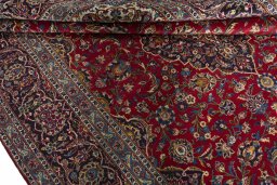 Close-up detail of 2000s Kashan rug from Iran / Persia showing Wool weave