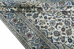 Close-up detail of 2000s Kashan rug from Iran / Persia showing Wool weave