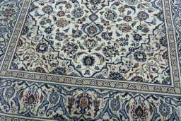 Close-up detail of 2000s Kashan rug from Iran / Persia showing Wool weave