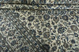 Close-up detail of 2000s Kashan rug from Iran / Persia showing Wool weave